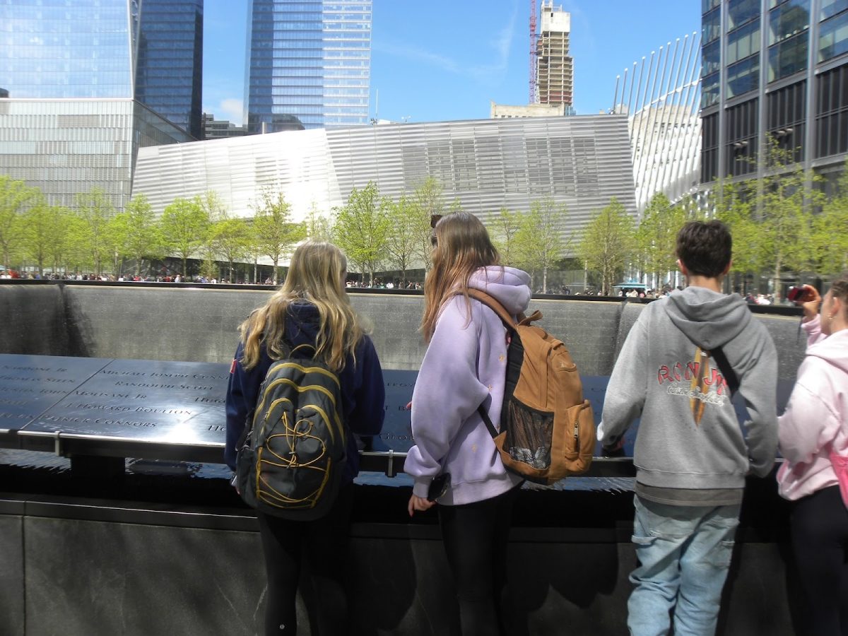 Elizabeth Martinko (11), Lauren Kelly (11), and Connor McGowan (11), looking at the South Tower’s 9/11 memorial. “The 9/11 memorial alone, had to be the best part of the field trip just because of the power it held,” junior Robert Rulavage said “It was completely silent and peaceful.” 