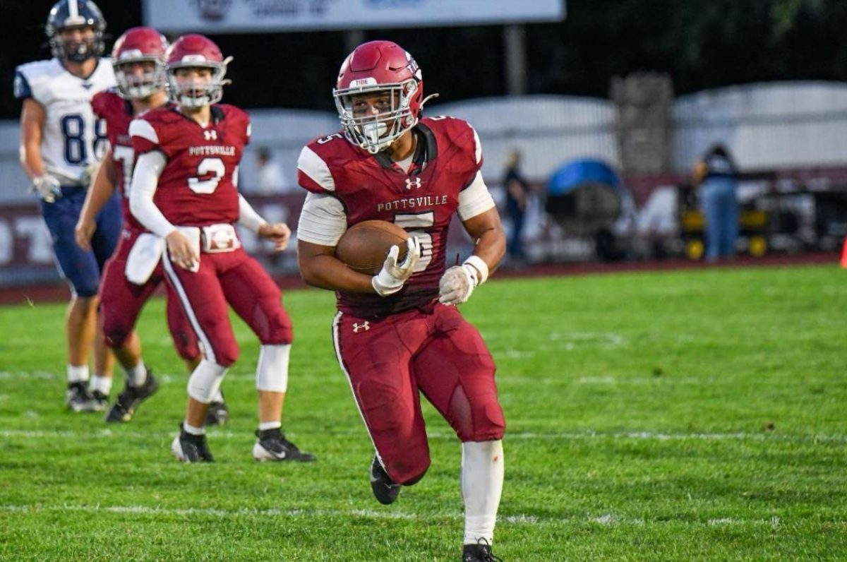 Juju Bainbridge runs for a first down against Tamaqua at home. The Tide lost the game in heartbreaking fashion allowing a last second touchdown.
