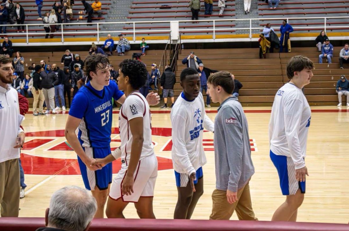 The Tide shakes hands with Minersville after their game on Thursday. The Tide lost this hard fought game by a score of 44-34.
