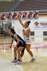 Senior Keirra Jones shooting a basket against the Blue Mountain Eagles. “I’ve always loved playing basketball, but there’s something so much more special about playing your senior year and being a mentor to the younger girls,” she said. 
