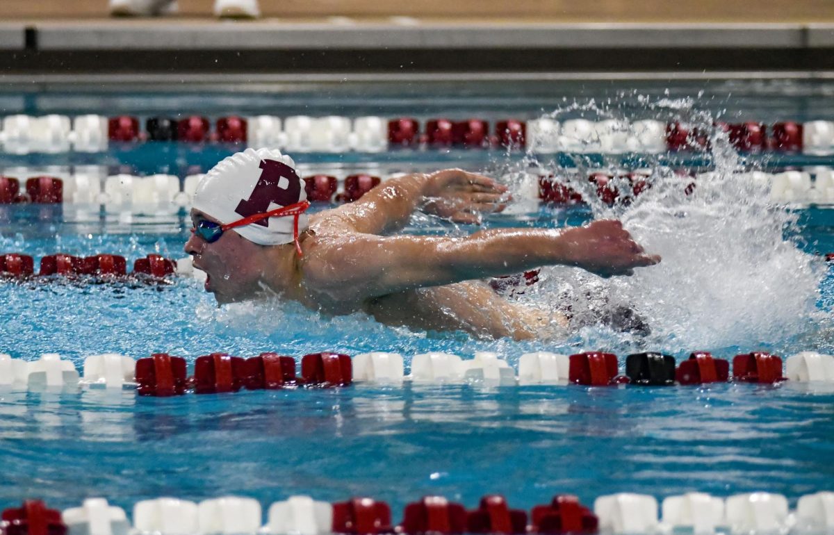 Freshman JP Mohl swims butterfly against North Schuylkill. He set a new PR for this meet. 