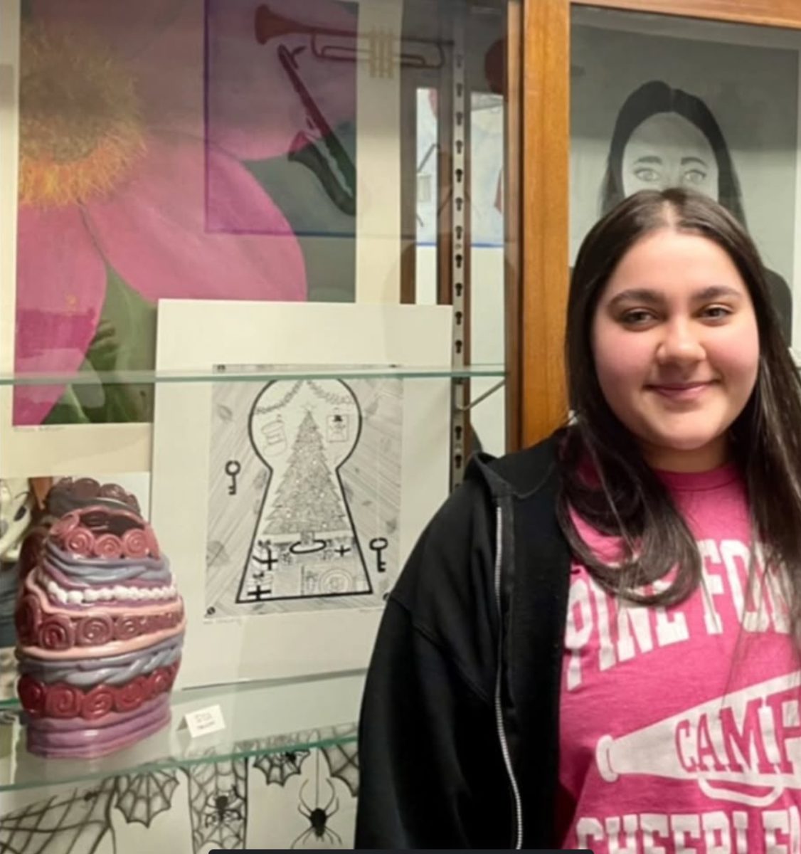 Senior student Tessa Nelson receives artist of the month for the month of March. Her artwork can be seen in the display case outside the art room.
